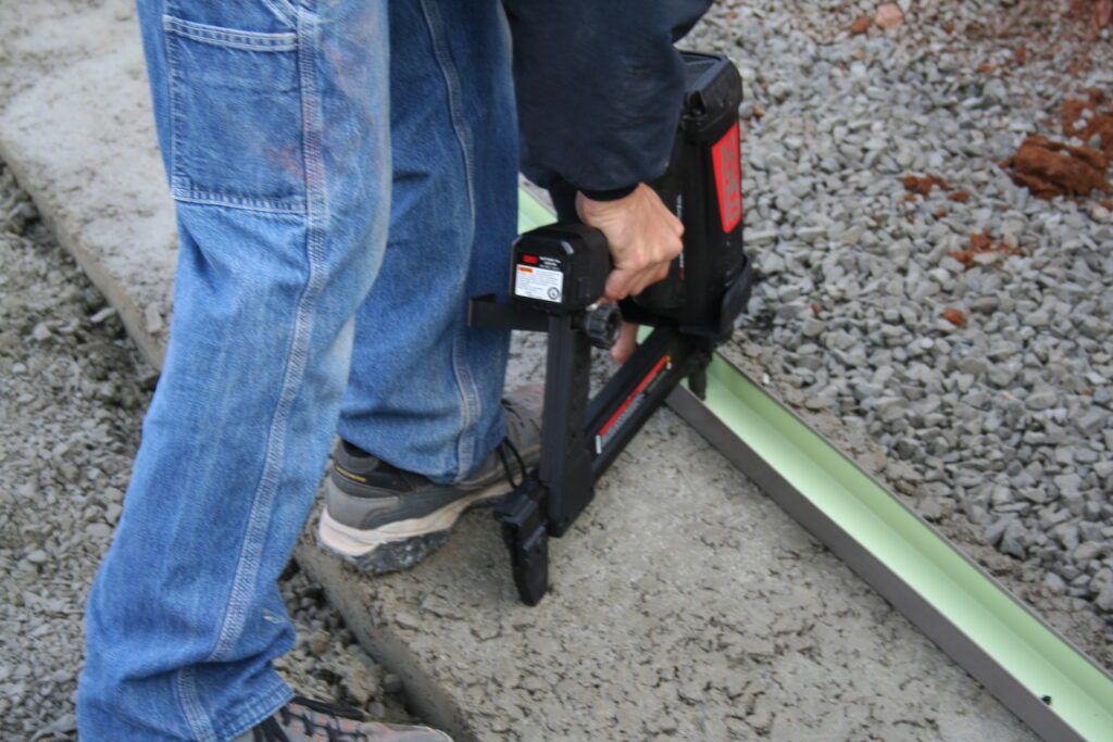 C-channel track nailed to footing